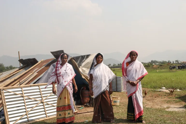 Three indigenous Muslims among the 4 million clad in Assamese traditional attire.