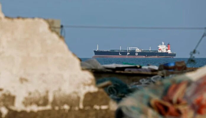 Iran warns of ceasefire violation as US plans to escort Hormuz ships