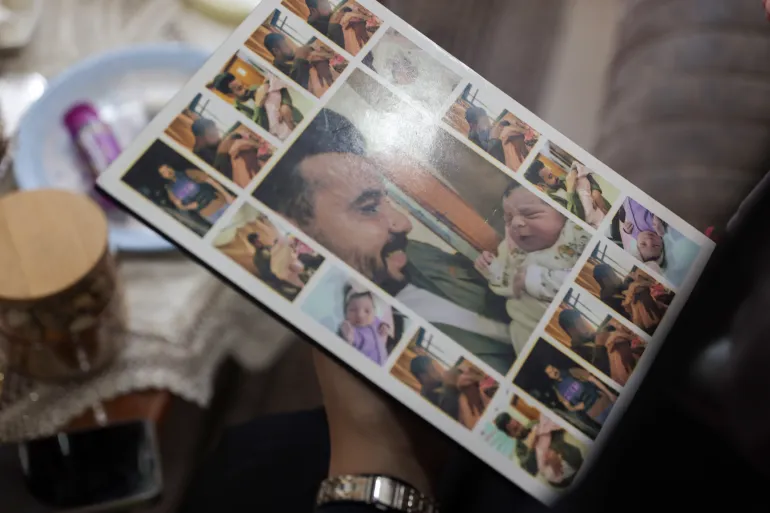The father was killed five hours after his daughter was born, after seeing her and holding her in his arms at the hospital that day [Abdelhakim Abu Riash/Al Jazeera]