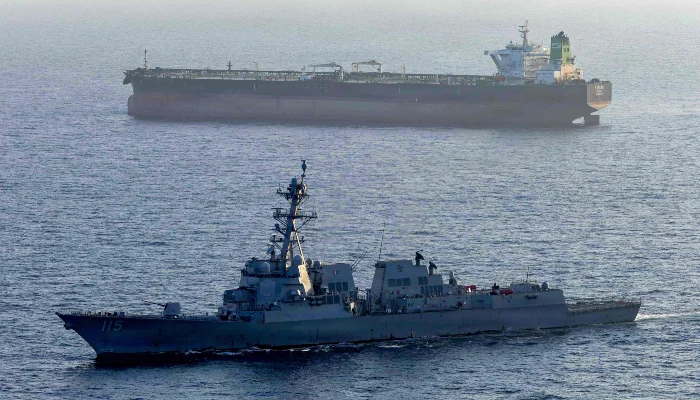 This US Navy handout photo, released on May 7, 2026, by US Central Command Public Affairs, shows the Arleigh Burke-class guided-missile destroyer USS Rafael Peralta (DDG 115) implementing a maritime blockade against the Iran-flagged crude oil tanker vessel Stream while the latter was attempting to sail toward an Iranian port, on April 26, 2026. — AFP