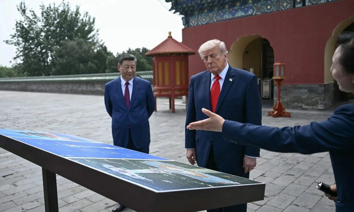 China’s President Xi Jinping (L) and US President Donald Trump (C) visit the Temple of Heaven in Beijing on May 14, 2026. — AFP