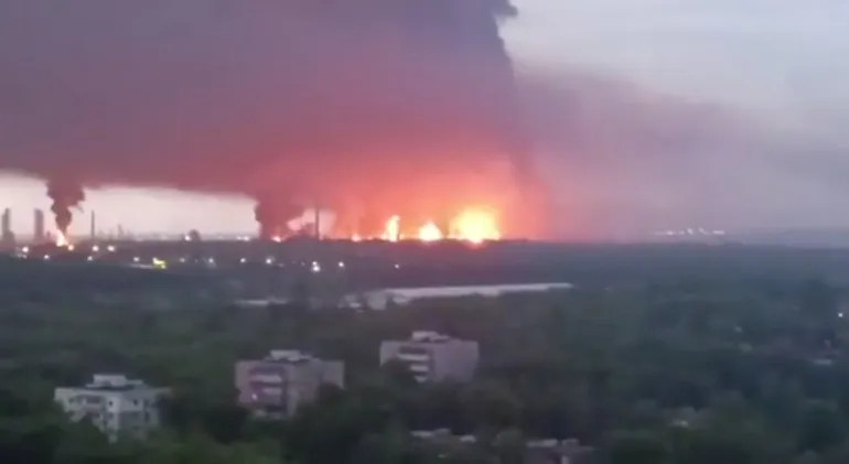 Fire and a plume of smoke rise in the vicinity of the Ryazan oil refinery, May 15, 2026. [Supplied via Reuters]