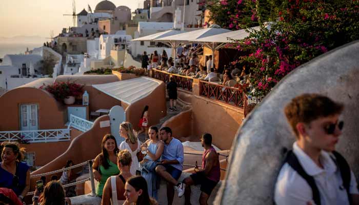 Tourists wait to view Santorini’s famed sunset, on Santorini, Greece, July 25, 2024.— Reuters/File