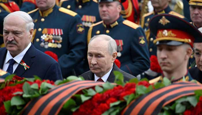 Russian President Vladimir Putin attends a ceremony to lay flowers at the Tomb of the Unknown Soldier by the Kremlin wall in central Moscow, Russia, on May 9, 2026. — Reuters