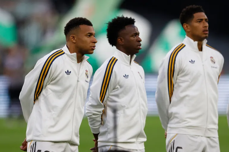 Real Madrid's Kylian Mbappe, Vinicius Junior and Jude Bellingham line up before a La Liga match 