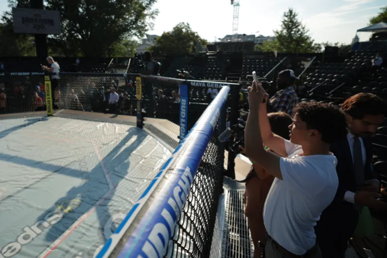 WASHINGTON, DC - JUNE 11: Journalists participate in a preview of the Ultimate Fighting Championship (UFC) "Claw" and the octagon fighting ring on the South Lawn of the White House on June 11, 2026 in Washington, DC. President Donald Trump is hosting a series of Ultimate Fighting Championship matches on the South Lawn on Flag Day and his 80th birthday, June 14, which the White House is calling "a once-in-a-generation celebration of the American fighting spirit." Chip Somodevilla/Getty Images/AFP (Photo by CHIP SOMODEVILLA / GETTY IMAGES NORTH AMERICA / Getty Images via AFP)