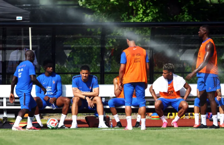 France's William Saliba, Ngolo Kante, Ibrahima Konate and Desire Doue take a seat during training.