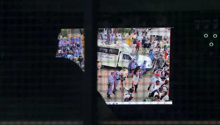 A police officer monitors CCTV footage from a mobile command-and-control vehicle at the Jantar Mantar protest site, where Indias Cockroach Janta Party (CJP) supporters have gathered ahead of a planned march to Parliament on the opening day of the monsoon session, demanding the resignation of Education Minister Dharmendra Pradhan over alleged exam paper leaks, in New Delhi, India, July 20, 2026. — Reuters