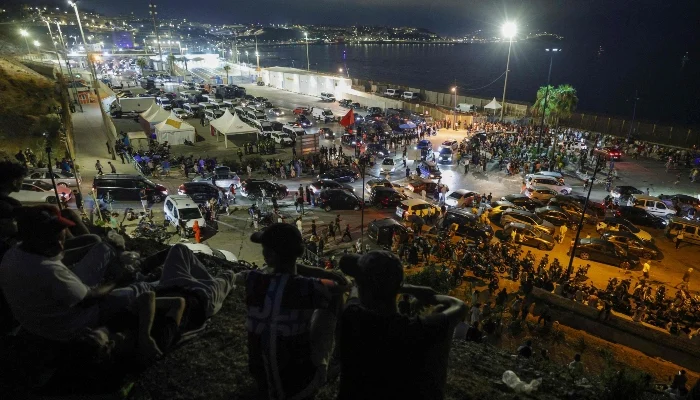 People gather at Bab Sebta, on the Morocco-Spain border near Spains enclave of Ceuta and the Moroccan town of Fnideq, on July 30, 2026. — AFP