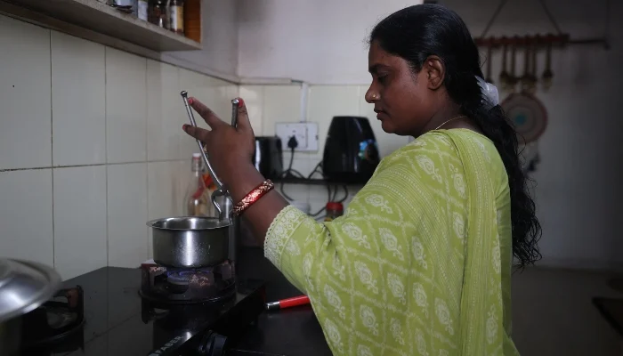 Mamta Singh, a housekeeper whose 21-year-old daughter appeared in the medical entrance exam, works inside the kitchen of Divya Unny, who had travelled to Delhi to join a protest by the Cockroach Janta Party over examination paper leaks, in Mumbai, India, July 28, 2026. — Reuters
