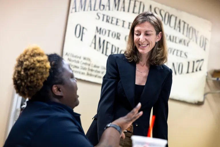 Former Rep. Elaine Luria, D-Va., speaks with Amalgamated Transit Union Local 1177 member Terraine Little on Thursday, July 9, 2026, in Norfolk, Va. (AP Photo/Kendall Warner)