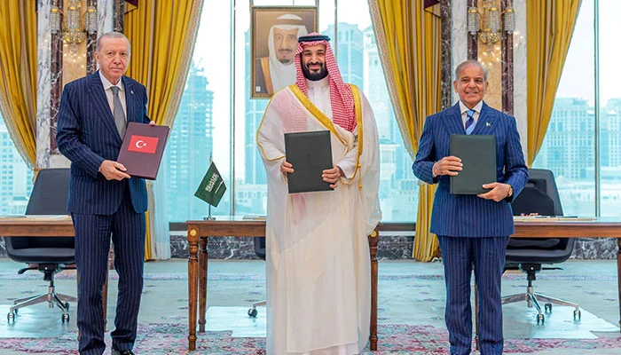 Turkiye President Tayyip Erdogan, Saudi Crown Prince Mohammed bin Salman, and Prime Minister Shehbaz Sharif pose after signing a joint defence agreement in Makkah, Saudi Arabia, August 7, 2026. — Reuters