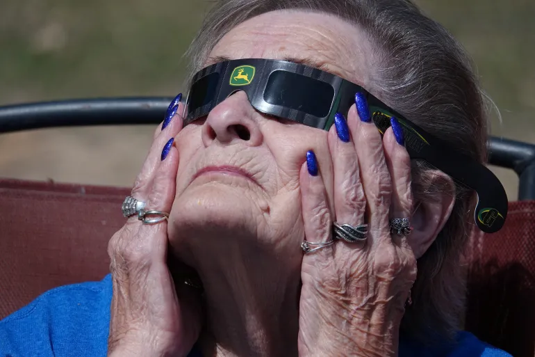 A woman views the total solar eclipse in Augusta, Arkansas, U.S. April 8, 2024. REUTERS/Karen Pulfer Focht
