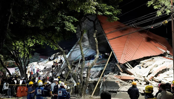 Rescuers work at the site of a collapsed building following an earthquake, in Cali, Colombia, August 10, 2026.— Reuters