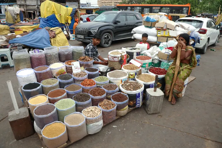 Vendors sell spices at a wholesale market in New Delhi