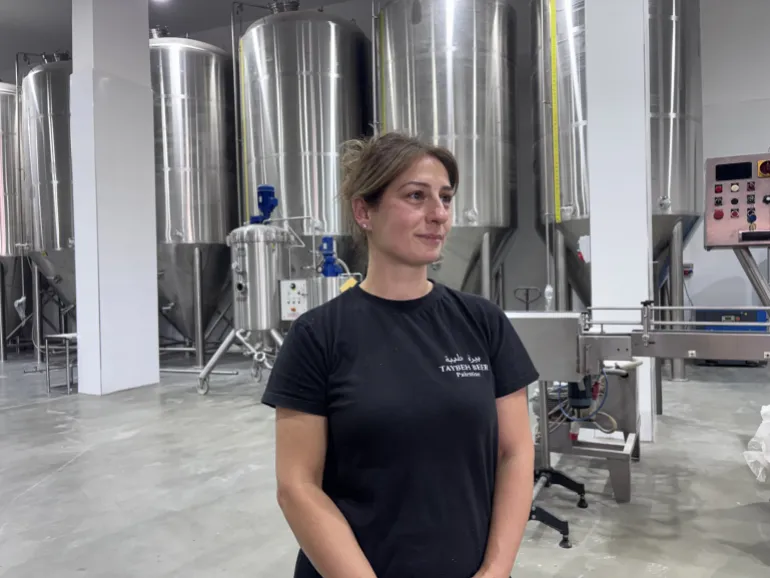 Madees Khoury at her family’s Taybeh Brewery [Al Jazeera]