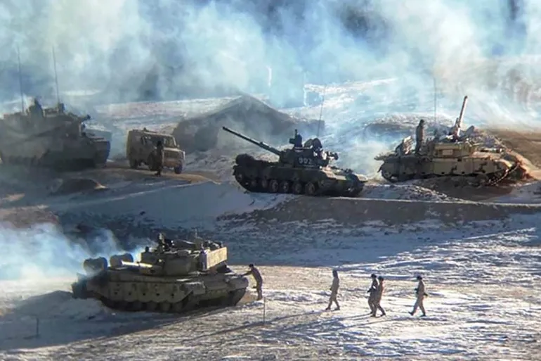 This undated handout photograph, released by the Indian army on February 16, 2021, shows People Liberation Army soldiers and tanks during a military disengagement along the Line of Actual Control (LAC) at the India-China border in Ladakh