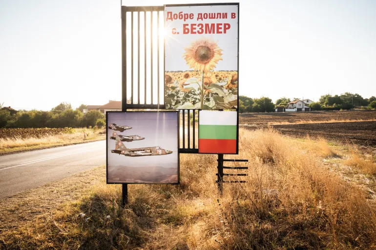 Road signs reading ‘Welcome to Bezmer’ invite visitors with images of sunflowers, three Sukhoi Su-25 fighters in flight and the Bulgarian flag