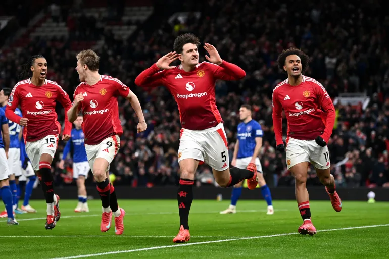 MANCHESTER, ENGLAND - FEBRUARY 26: Harry Maguire of Manchester United celebrates scoring his team's third goal during the Premier League match between Manchester United FC and Ipswich Town FC at Old Trafford on February 26, 2025 in Manchester, England. (Photo by Gareth Copley/Getty Images)