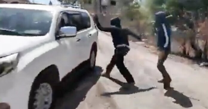 Masked Israeli settlers attack Palestinian woman, NBC News team in West Bank