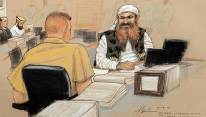 Khalid Sheikh Mohammed (R), the alleged mastermind of the September 11 attacks, speaks with his defence lawyer on the third day of pre-trial hearings in the 9/11 war crimes prosecution, as depicted in this Pentagon-approved courtroom sketch at the U.S. Naval Base Guantanamo Bay, Cuba, October 17, 2012.— Reuters