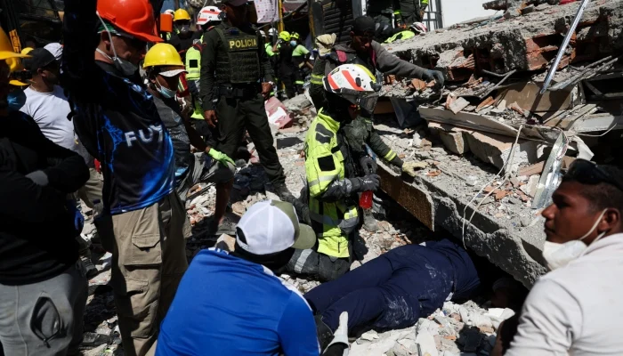 Rescuers search for survivors at the site of a collapsed building, following an earthquake, in Pereira, Colombia, August 11, 2026. — Reuters