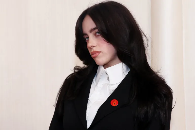 Billie Eilish poses on the red carpet during the Oscars arrivals at the 96th Academy Awards in Hollywood, Los Angeles, California, U.S., on March 10, 2024 [Aude Guerrucci/Reuters]