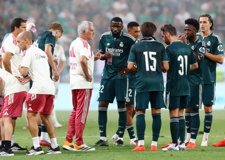 Real Madrid coach Jose Mourinho with the players during a preseason friendly
