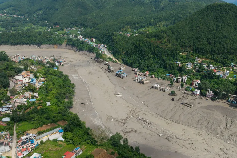 A drone view shows mud covering properties following the flash flood, in the Nuwakot district, Nepal, August 26, 2026 [Reuters]
