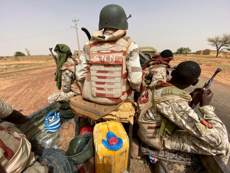 Nigerien soldiers patrol outside the town of Ouallam, Niger [Reuters]