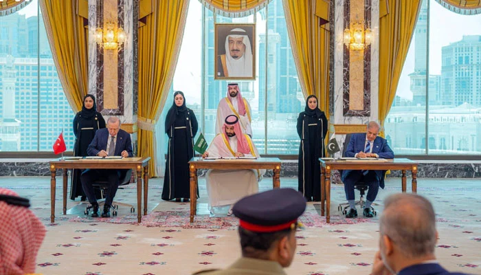 Turkish President Tayyip Erdogan, Saudi Crown Prince Mohammed bin Salman, and Pakistans Prime Minister Shehbaz Sharif sign a joint defence agreement in Makkah, Saudi Arabia, August 7, 2026. — Reuters