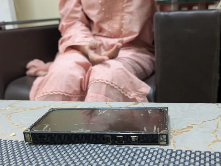 Noreen's phone, left behind in the nursery during the fire. Hospital guards recovered it and returned it to her the next day. [Abid Hussain/Al Jazeera]