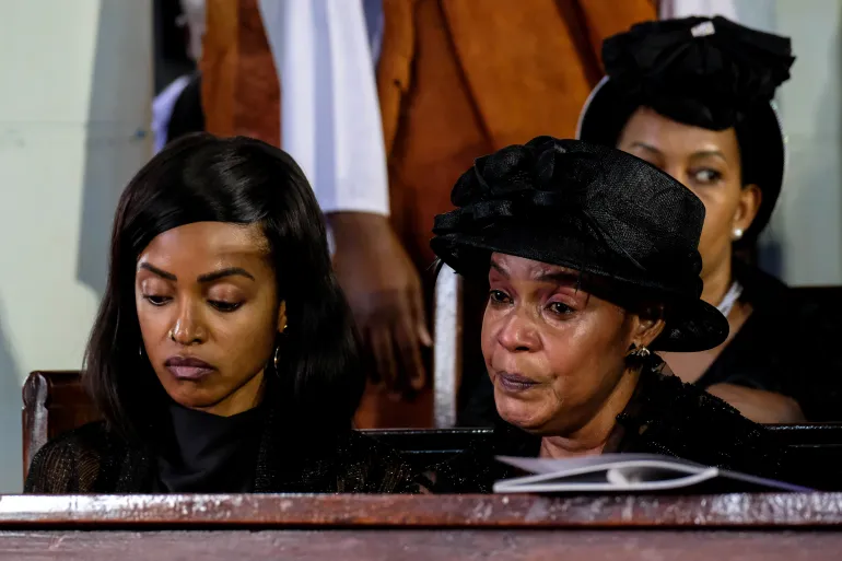 FORT PORTAL, UGANDA - SEPTEMBER 12: Queen Mother, Best Kemigisa (R) and her daughter (L) Princess Ruth Komuntale, attend a requiem mass for the late King Oyo Nyimba Kabamba Iguru Rukidi IV of Tooro, at the St. John's Cathedral ahead of the king's burial at the Karambi Royal Tombs, on September 12, 2026 in Fort Portal, Uganda. An official burial is taking place for Oyo Nyimba Kabamba Iguru Rukidi IV, a traditional Ugandan ruler of the Tooro kingdom, who died aged 34 on August 27, 2026, while being treated for a critical illness in the United States. In the wake of the king's death, a dispute has broken out between the monarch's family and the succession committee over who should succeed him. (Photo by Hajarah Nalwadda/Getty Images)
