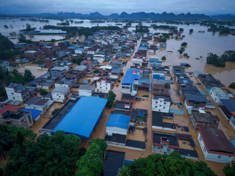 A drone view shows buildings partially submerged in floodwaters after heavy rainfall brought by typhoon Maysak, in Hengzhou, Guangxi Zhuang Autonomous Region, China July 6, 2026. China Daily via REUTERS ATTENTION EDITORS - THIS IMAGE WAS PROVIDED BY A THIRD PARTY. CHINA OUT.