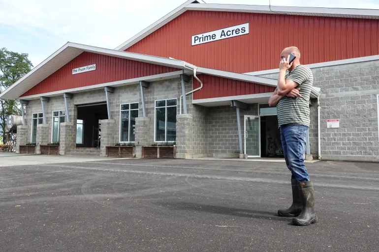 Casey Pruim, owner of Prime Acres Ltd. has a herd of 330 cows at his dairy farm in Abbotsford, British Columbia [Ali Mustafa/Al Jazeera]