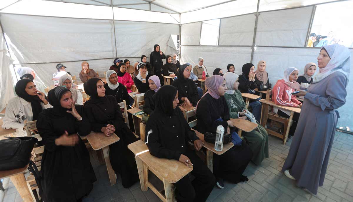 A Palestinian teacher conducts a lesson for displaced Palestinian students, including Samar Abu Salmi, 15, inside a tent classroom in Khan Younis, in the southern Gaza Strip, September 20, 2026.— Reuters