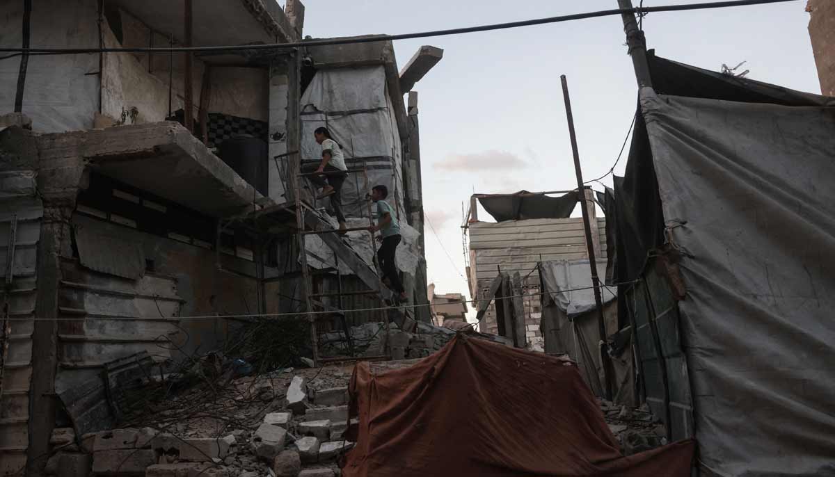 Displaced Palestinian children walk up the stairs of a heavily damaged building being used as a shelter in Khan Yunis in the southern Gaza Strip on September 19, 2026.— AFP