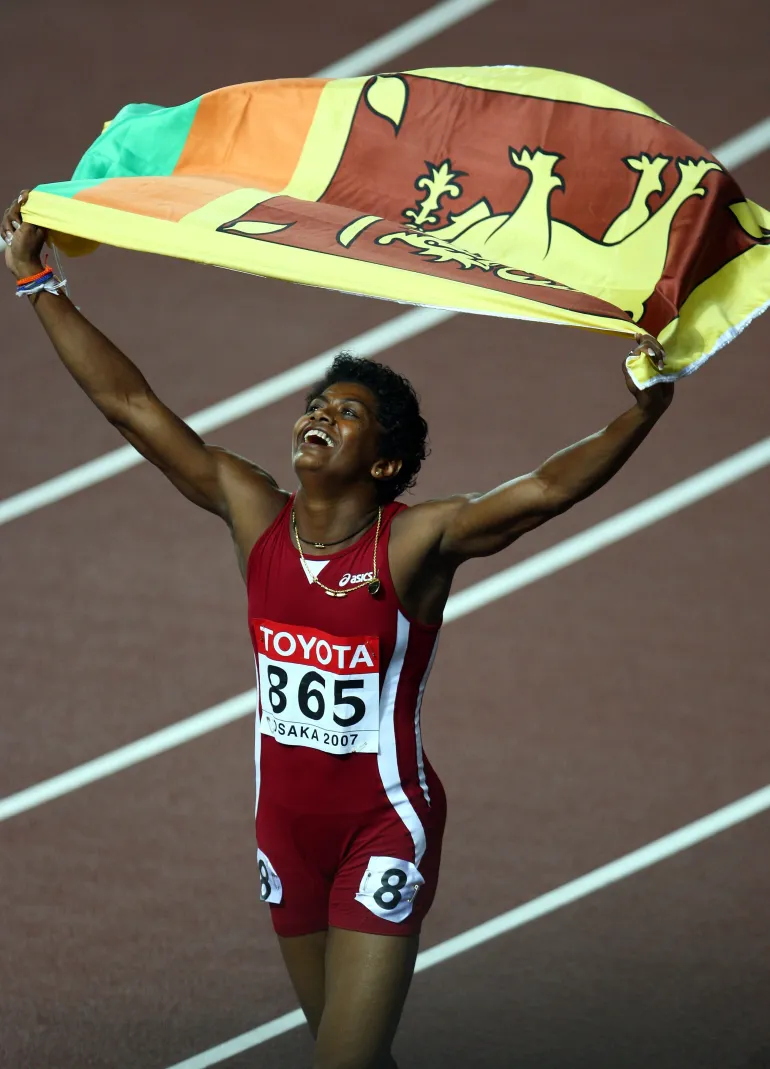 OSAKA, JAPAN - AUGUST 31: Susanthika Jayasinghe of Sri Lanka celebrates finishing in third place in the Women's 200m Final on day seven of the 11th IAAF World Athletics Championships on August 31, 2007 at the Nagai Stadium in Osaka, Japan. (Photo by Michael Steele/Getty Images)