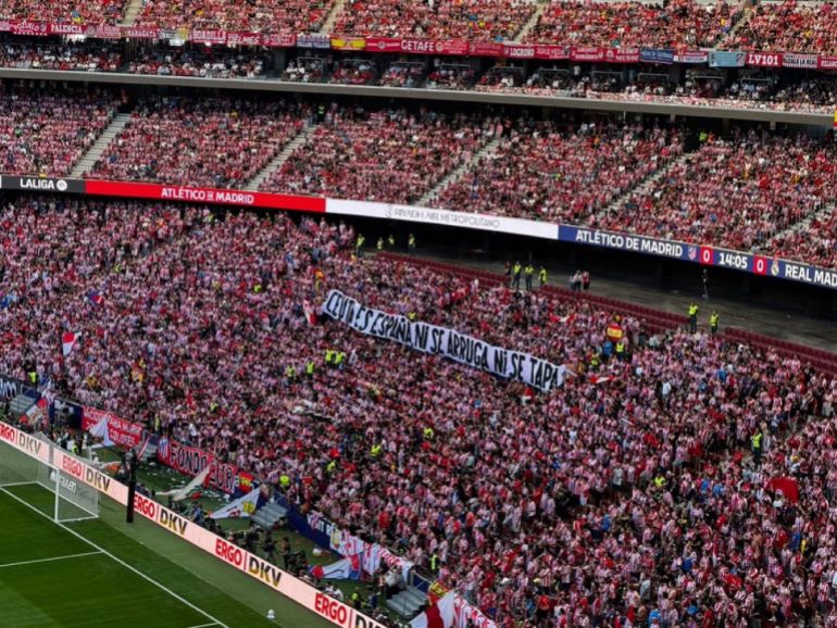 Fans hold a banner during the Atletico Madrid vs Real Madrid match in the Spanish La Liga at the Metropolitano Stadium in Madrid on Sunday, September 20, 2026 [Leyla Hamed/Al Jazeera]