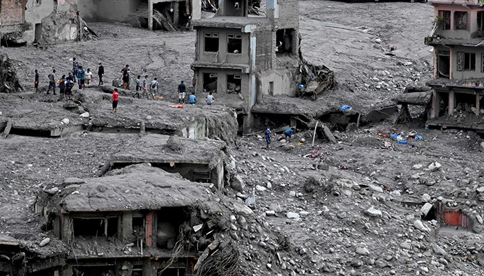 People scout for usable materials from debris after flash floods at Trishuli Center in Nepals Nuwakot district on September 1, 2026. — AFP