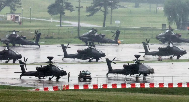 AH-64 Apache attack helicopters at Camp Humphreys on the final day of the annual US-South Korea UFS joint military exercise, which was shortened by six days after President Donald Trump ordered a substantial reduction in US participation, in Pyeongtaek, South Korea, August 21, 2026 [Yonhap via Reuters]