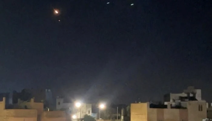 A flash of light appears in the sky as air defence operates to intercept projectiles fired by Irans Revolutionary Guard, in Ash-Shajarah, Jordan, September 9, 2026. — Reuters
