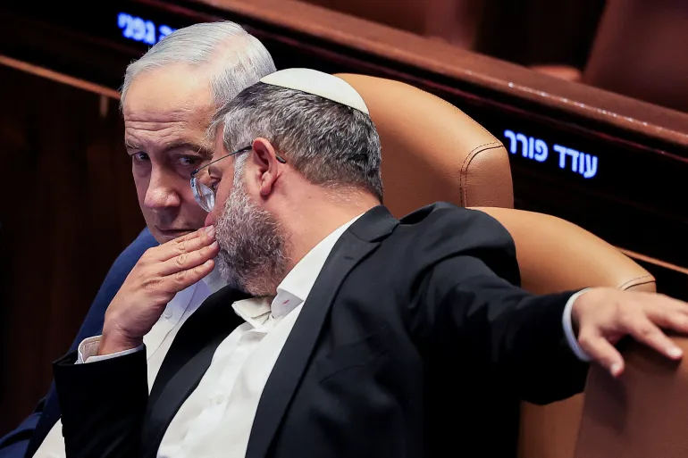 Israel's Minister of National Security Itamar Ben-Gvir speaks with Prime Minister Benjamin Netanyahu, during a session at the Knesset, Israel's parliament, before it dissolves ahead of the 2026 Israeli elections, in Jerusalem, July 16, 2026. REUTERS/Ronen Zvulun TPX IMAGES OF THE DAY