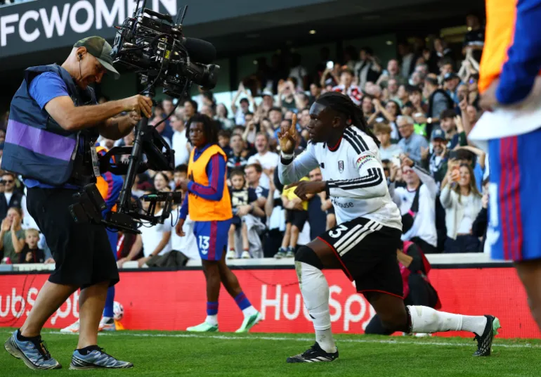 Fulham's Calvin Bassey celebrates their first goal, an own goal scored by Manchester United's Lisandro Martinez