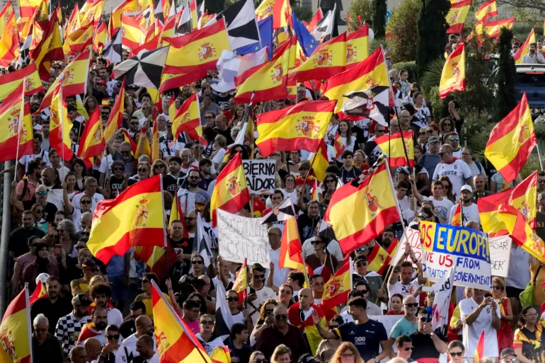 epa13207419 People attend a rally called on occasion on Ceuta Day and amid the migrant crisis in Ceuta, Spain, 02 September 2026. Rallies have been called in front of town halls across Spain as the country faces a massive migration crisis after thousands of people crossed into the North African enclave of Ceuta from Morocco in late July 2026. EPA/REDUAN