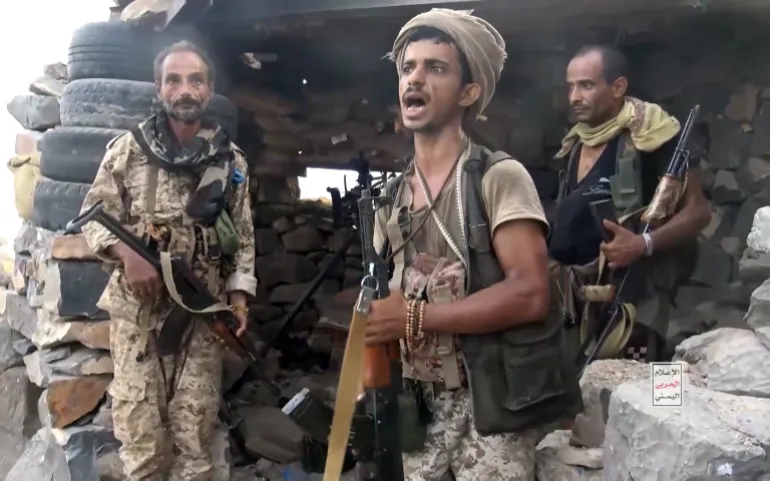 epa13237566 A screen grab taken from an undated handout video released on 13 September 2026 by the Houthi military media center shows Houthi fighters standing guard at a seized camp during an offensive in the port city of Mokha, western coast of Yemen. Yemen's Saudi-backed government accused Iran and its regional allies of supporting the Houthis recent offensive, during which the group captured key port areas, including Mokha, and seized control of strategic maritime positions along the Bab al-Mandab Strait. EPA/HOUTHI MILITARY MEDIA CENTER HANDOUT HANDOUT EDITORIAL USE ONLY/NO SALES