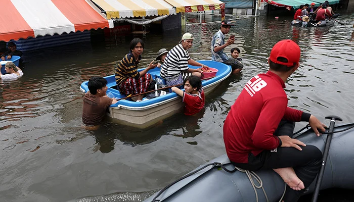 People travel by boats in a flooded street in Bangkok, Thailand, September 28, 2026. — Reuters