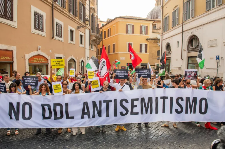 Rome, picket in front of Montecitorio, seat of the Chamber of Deputies, to protest against the new "antisemitism bill", that wants to rewrite the definition of antisemitism, largely criticized for its potential criminalisation of the Pro Palestinian movement. In the picture: the head of the protest with the banner "no antisemitism bill"
