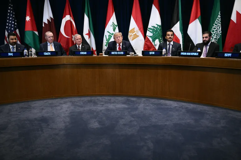 US President Donald Trump (C) attends a Gulf Cooperation Council (GCC) multilateral meeting alongside (L/R) Iraqi Prime Minister Ali al-Zaidi, Turkey's President Recep Tayyip Erdogan, King Abdullah II of Jordan, Qatar's Emir Sheikh Tamim bin Hamad al-Thani and Syrian President Ahmed al-Sharaa on the sidelines of the 81st United Nations General Assembly in New York on September 22, 2026. (Photo by Brendan SMIALOWSKI / AFP)