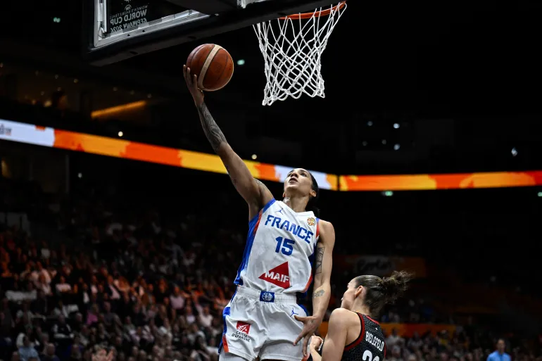 France's forward #15 Gabby Williams (L) and Germany's point guard #25 Clara Bielefeld vie for the ball during the 2026 FIBA Women's Basketball World Cup semi-final match between France and Germany in Berlin on September 12, 2026. (Photo by Tobias SCHWARZ / AFP)